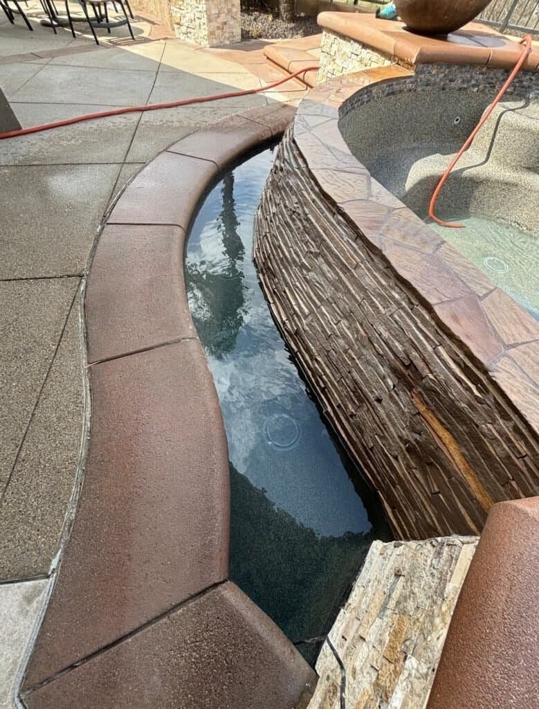Custom pool plaster with natural stone texture for durable, aesthetic pool finishes.