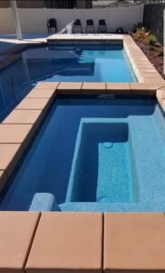 Beautiful backyard pool with high-quality plaster finish, showcasing CA’s Finest pool plastering expertise. Custom pool plastering with smooth finishes for a luxurious backyard pool.